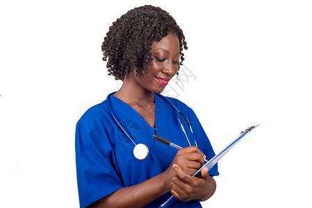 女护士或医生在蓝上衣时微笑图片