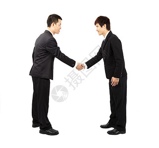 亚洲商人握手和鞠躬图片