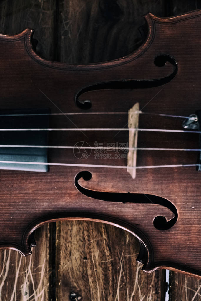 前侧小提琴的抽象艺术设计背景图片