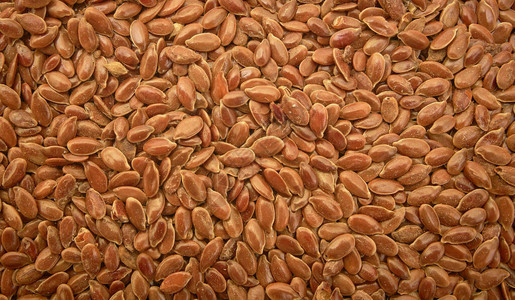 亚麻籽用于制造亚麻籽油棕色亚麻籽背景图片