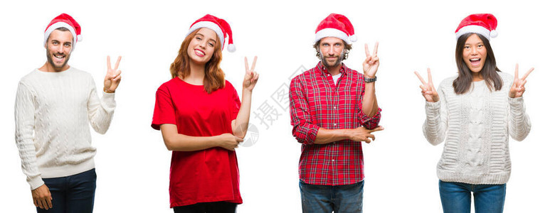 一群戴着圣诞帽的人在孤立的下微笑着图片