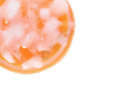 橙色海绵湿润泡沫在白色图片