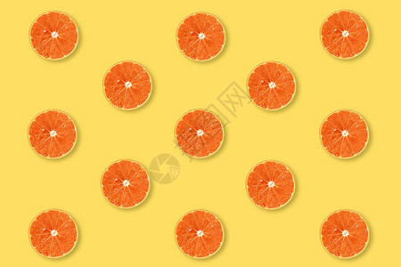 黄色柔和背景上的半橙色图案图片