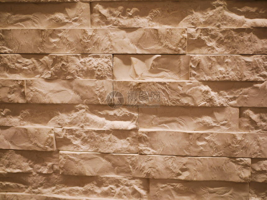 凹凸不平的石材立面特写撕裂的石头纹理石墙斯通图片