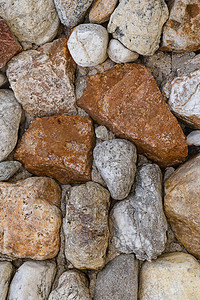 多色石头不均匀的灰色和棕色图案的石头背景图片