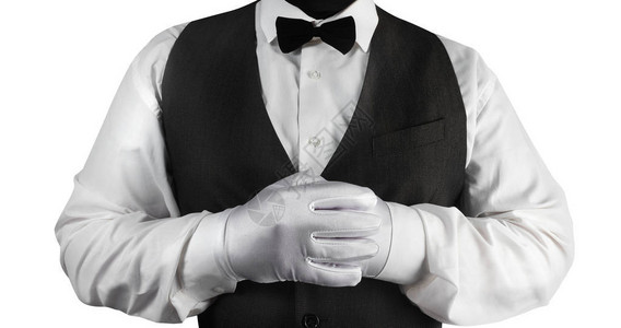 一张白衬衫服务员黑色外衣和白色手套的相片图片