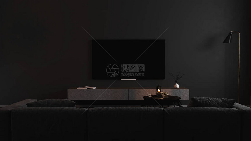 现代黑暗室内的空白电视屏幕与黑暗中的灰色沙发模拟图片