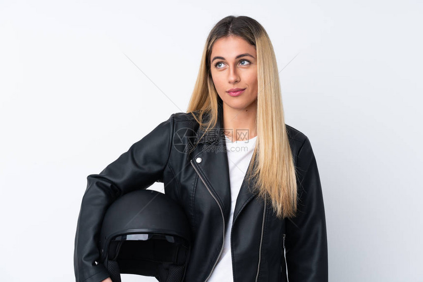 带着摩托车头盔的乌拉圭年轻女图片