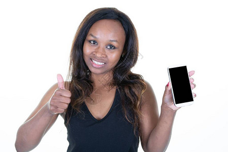 微笑的女人大拇指用空屏幕显示移动电话图片