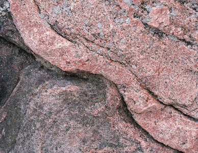 自然石表面的抽象背景表面有红底结图片