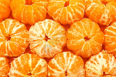 许多甜去皮的橘子作为背景图片