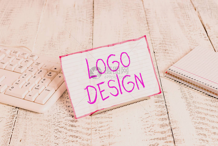 概念手写显示标志设计概念意味着公司名称或商标的图形表示或符号在计算机键盘和工作表之间的电图片