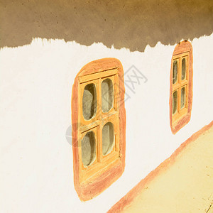 粘土小屋里的老式木窗背景图片