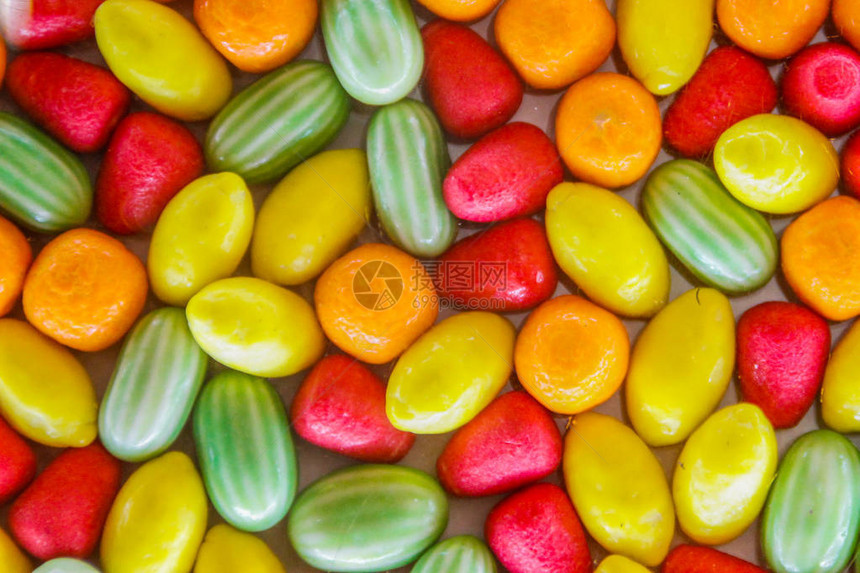 糖果和糖果的明亮多汁甜美彩色背景图片