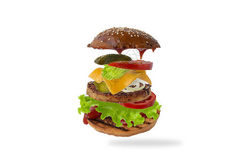 美味的汉堡与孤立的白色背景上的飞行成分食品悬浮概念经典汉堡图片
