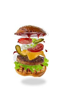 美味的汉堡与孤立的白色背景上的飞行成分食品悬浮概念经典汉堡图片