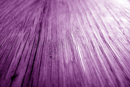 紫色模糊效果的木质板纹理摘要背景和设计图图片