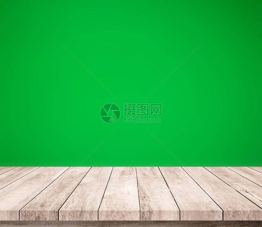 木板桌面与抽象绿色背景图片