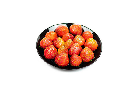 黑色盘子里的新鲜草莓水果被图片