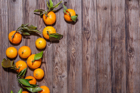 橙色柑橘果实白色木质背景顶视图图片