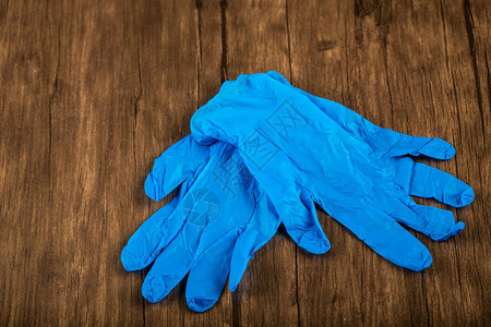 孤立的蓝色手面具或手套图片
