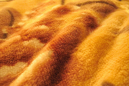 卷状毛堆积的波形织物纹理摘要为橙色图片