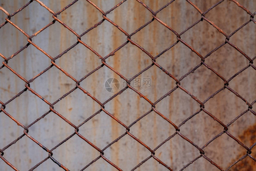 Rusty网格背景纹理股面照片集中在栅栏的一个图片