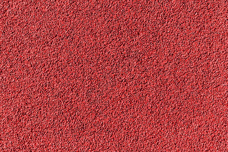 田间运动场纹理抽象背景的红色橡皮球粒表面田径运动中的图片