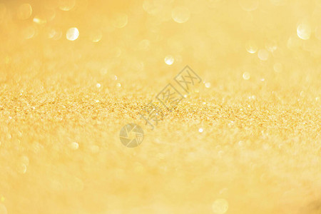 焦点分散的金亮光背景金抽象bokeh背景图片