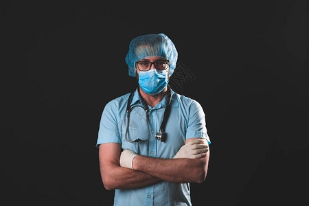 医生护士外科医生心理学家与防护面罩眼镜和手套一起工作图片