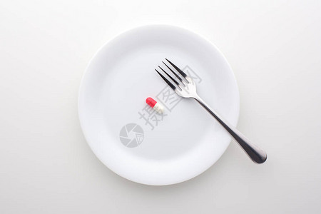 在白板上加叉子的白板上的饮食补图片