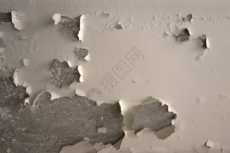 白色油漆剥落的混凝土墙体纹理图片