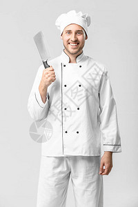 白色背景的英俊男厨师图片