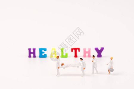 微型peaple健康团队合作帮助具有健康文图片