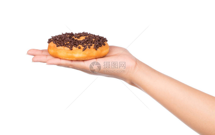 手握美味甜圈巧克力在白图片