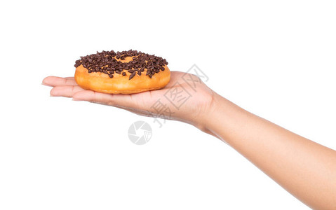 手握美味甜圈巧克力在白图片