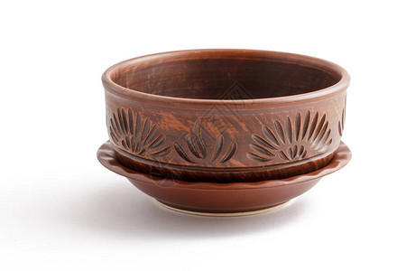 美丽的棕色陶瓷碗有白色废图片