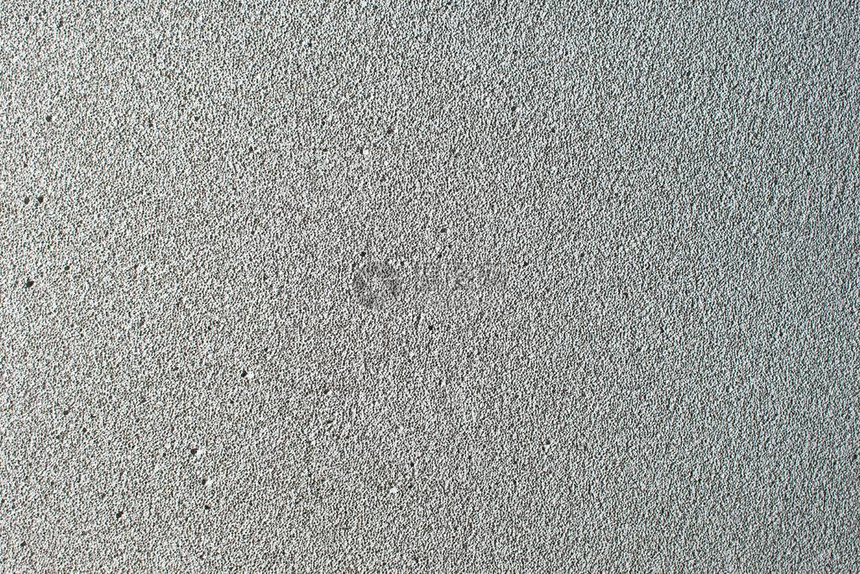 泡沫混凝土砌块墙作为背景灰色轻质建筑砖上白色孤立轻质泡沫石膏图片