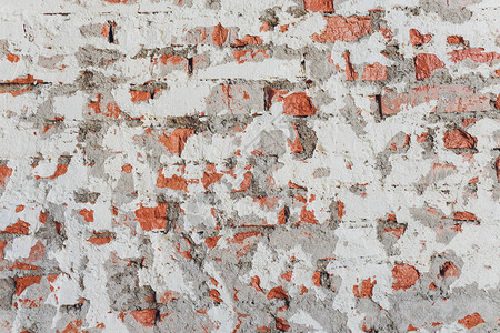 旧砖墙石膏剥落垃圾背景图片