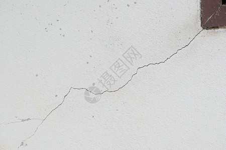 破旧的白墙粗糙纹理风化背景图片