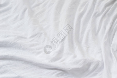 打褶的白色棉质材料纹理或背景图片