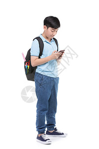 背包和文具的亚洲学生男孩手持机图片