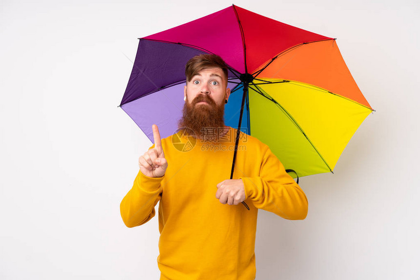 长胡子红头发的红头人拿着雨伞在孤立的白色背景上用食指图片