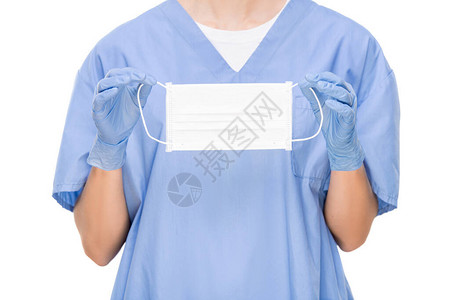 在清洗和外科手套中无法辨认的外科医生图片