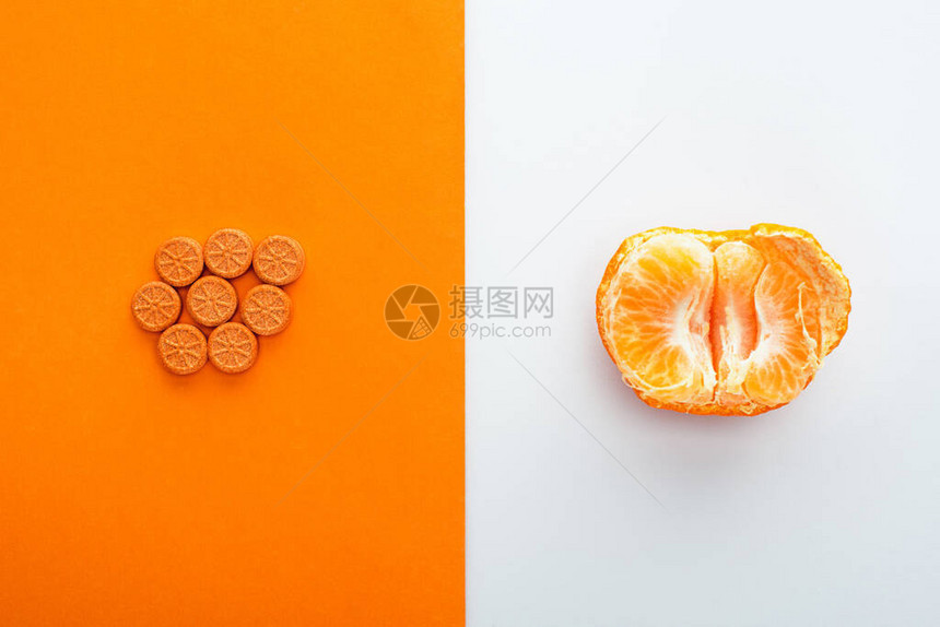 白色和橙色背景的药片和图片