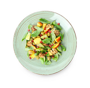白色背景上美味健康新鲜沙拉的盘子图片