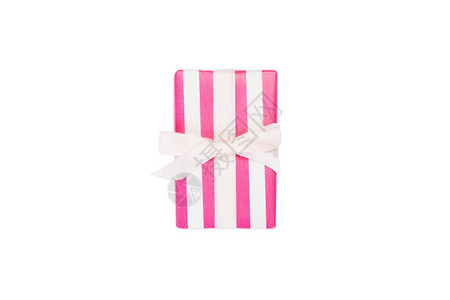 圣诞节或其他节日手工制作的礼物用粉红色的纸和白丝带图片