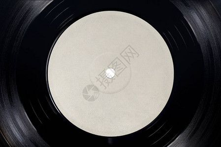 LP黑乙烯唱片的白色空白标签近距离拍摄背景图片