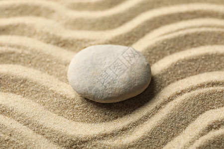 沙子上的石头有型态背景图片