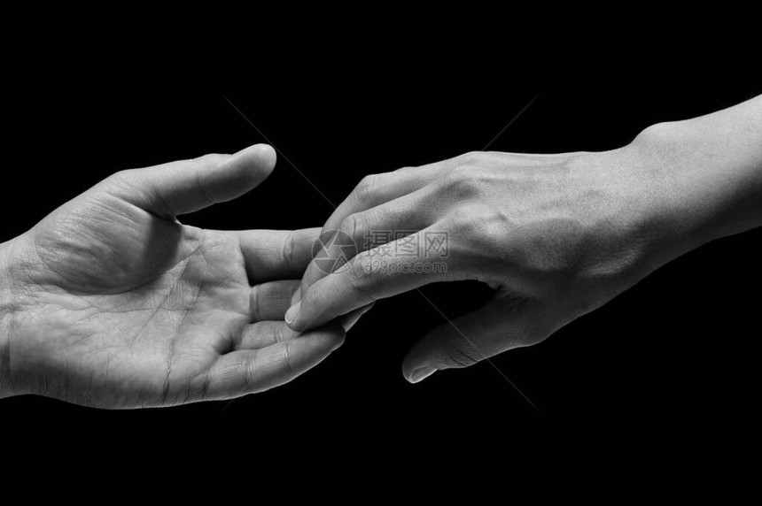 分手时两只手的黑白照片分手的概念在孤立的黑色图片